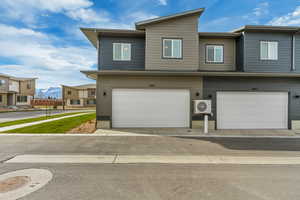 Back of home. Paved road and cement driveway