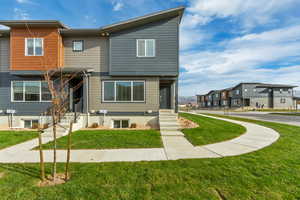 View of front of house featuring a front lawn