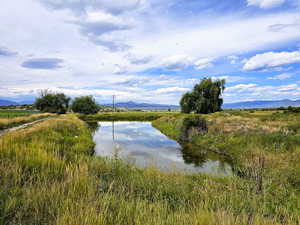 View of water feature featuring a mountain view and a rural view