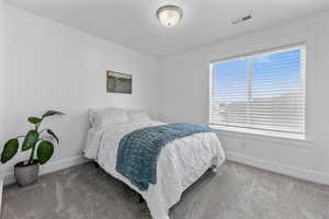 View of carpeted bedroom