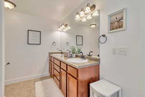 Bathroom with vanity and tile patterned floors