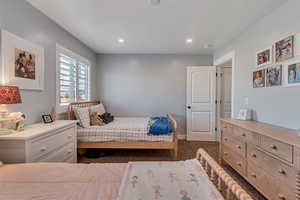 Bedroom featuring dark colored carpet