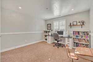 View of carpeted home office