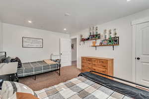 Bedroom featuring carpet flooring