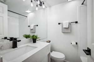 Bathroom with vanity and toilet