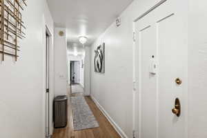 Corridor featuring hardwood / wood-style flooring