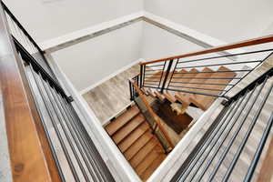 Stairs with hardwood / wood-style floors