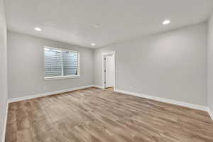 Spare room with light hardwood / wood-style floors