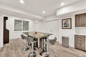 Dining room with light hardwood / wood-style floors