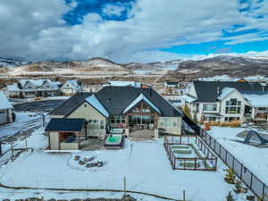 Snowy aerial view featuring a mountain view