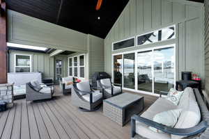 Wooden deck featuring an outdoor hangout area and area for grilling