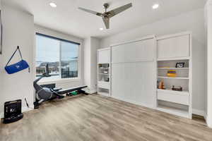 Interior space featuring a textured ceiling, light wood-type flooring, and ceiling fan