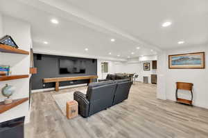 Living room with light hardwood / wood-style flooring