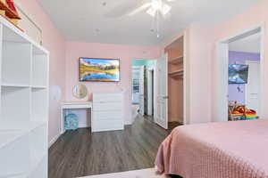 Bedroom with LVP floors and ceiling fan