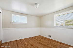 Empty room featuring hardwood / wood-style floors