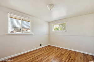 Spare room with hardwood / wood-style flooring