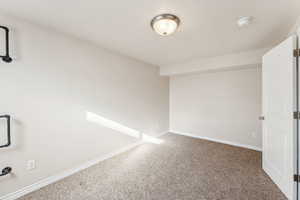 Empty room with carpet floors