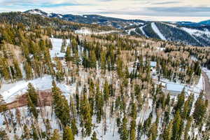 Snowy aerial view with a mountain view