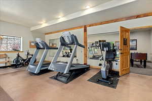 Workout area with a textured ceiling