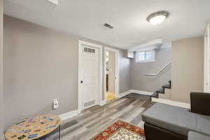 Entryway featuring wood-type flooring and a textured ceiling