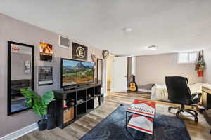 Office area with hardwood / wood-style flooring