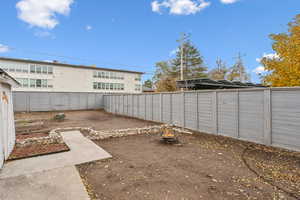 View of yard with an outdoor fire pit