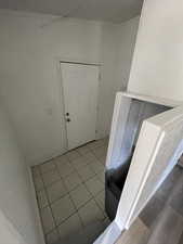 Entryway with light tile patterned floors