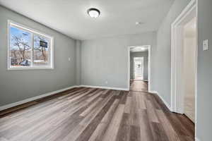 Unfurnished room featuring wood-type flooring