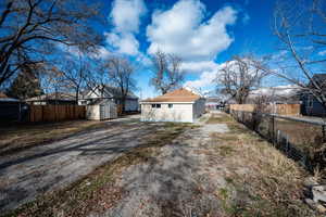 Exterior space with a storage shed