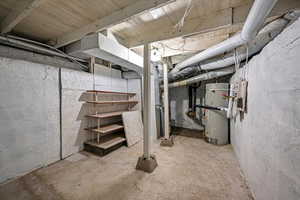 Basement featuring secured water heater