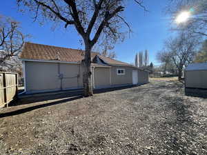 View of home's exterior with a storage shed