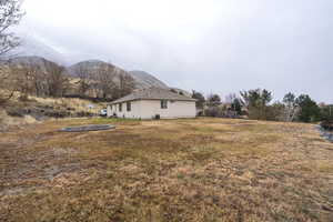 View of yard featuring a mountain view and a trampoline