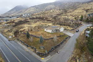 Birds eye view of property with a mountain view