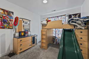 Bedroom featuring carpet