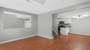 Unfurnished living room with light wood-type flooring