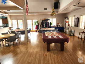 Playroom featuring wood-type flooring and pool table