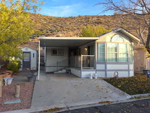 View of front of home with a carport