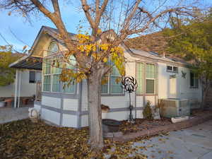 View of front of property featuring central AC