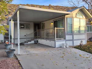 View of front facade featuring a carport