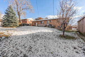 View of yard covered in snow