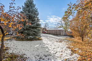 View of yard layered in snow