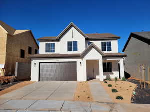 View of front of property with a garage