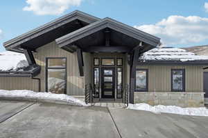 View of snow covered property entrance