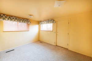 View of carpeted spare room