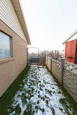 Side view of yard covered in snow