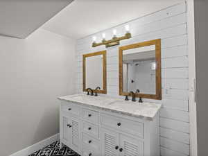 Bathroom with wooden walls and vanity