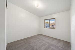 Empty room with carpet flooring