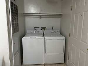 Washroom featuring washer and dryer