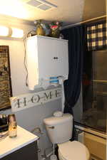 Duplex # A Bathroom with toilet and a textured ceiling