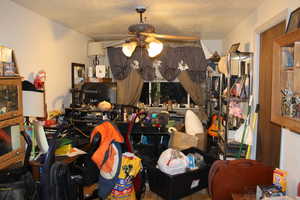 Duplex # A Dinning or space featuring a textured ceiling and ceiling fan